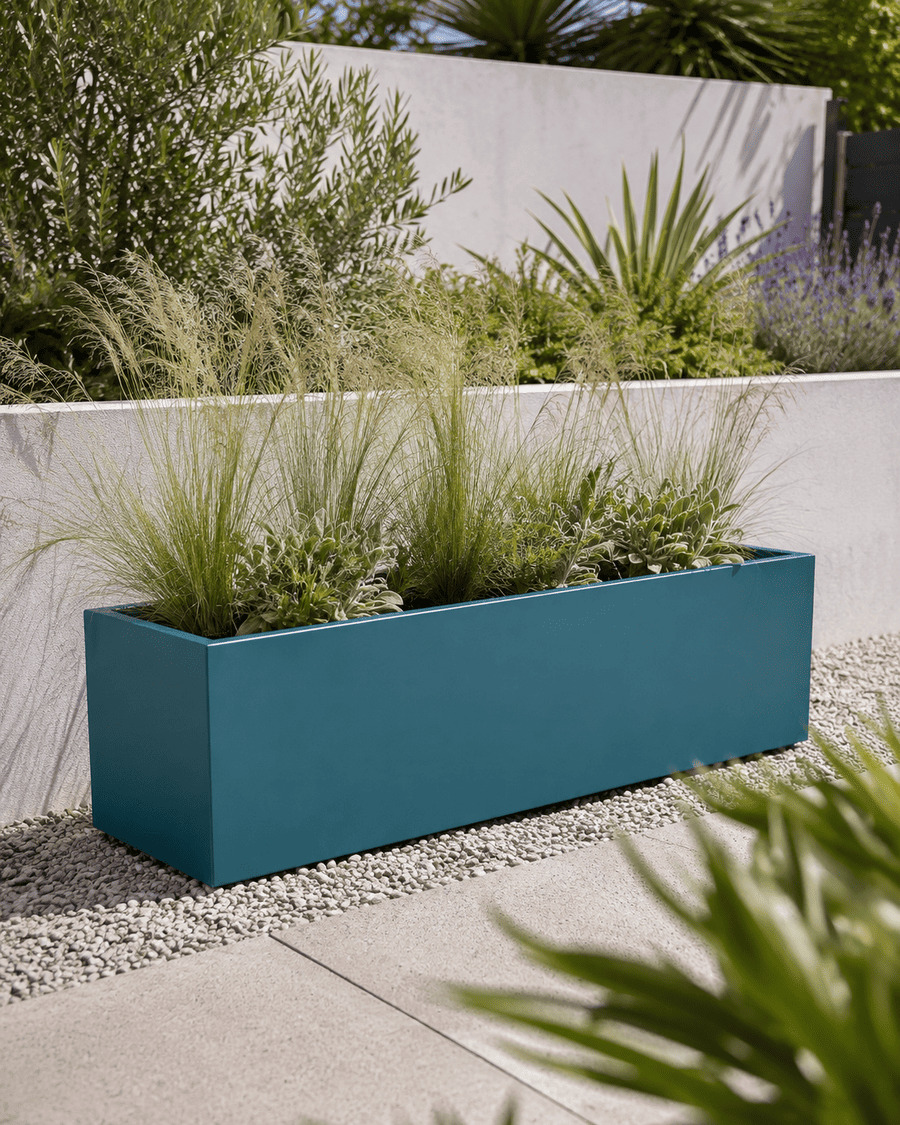 Blue planter in a contemporary garden border